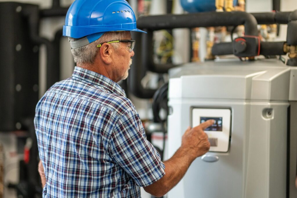 Engineer examining control panel